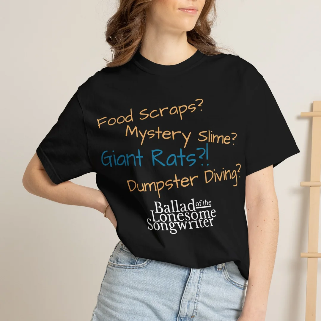 Woman wearing the Ballad of the Lonesome Songwriter T-shirt, showing its question-based front design